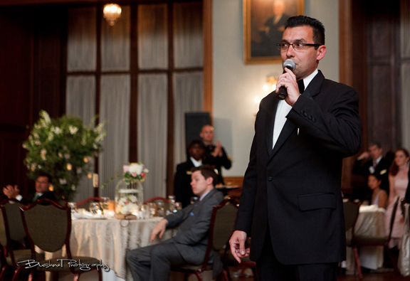 A polished wedding emcee guiding a reception moment